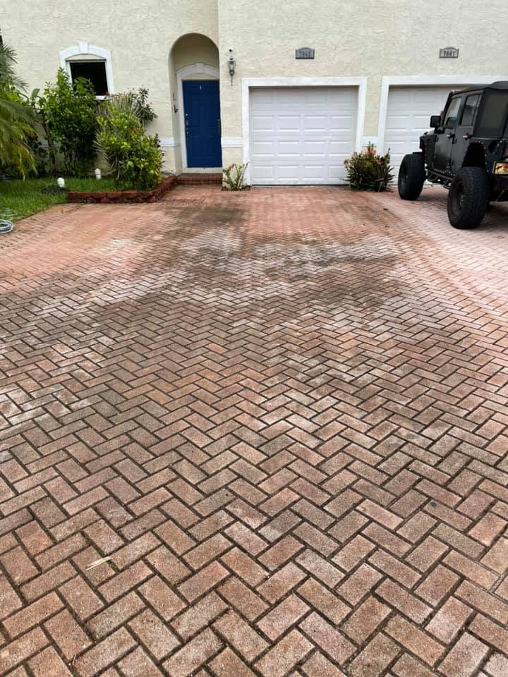 Paver driveway restoration with polymeric re-sand in Jupiter